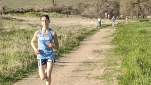 Sophomore and Varsity girl’s runner, Chloe Alchin, leads the pack at the final stretch to the finish line, placing 1st overall against Sutter High School at Sutter’s home course.