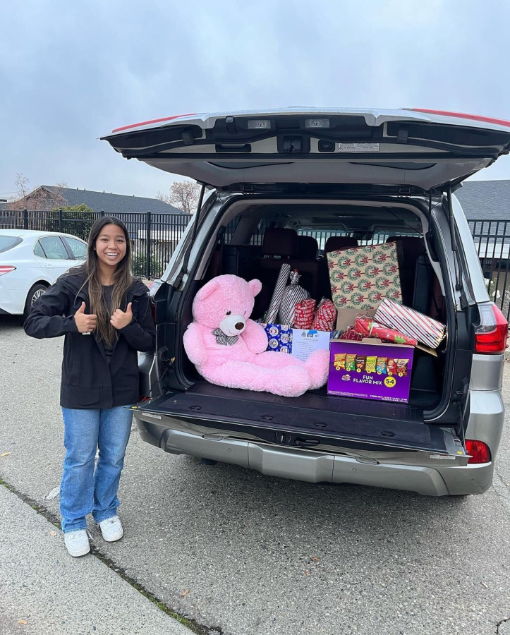 From CSFs Instagram page

Elaina Truong with the donations from their completed Adopt-A-Family campaign.