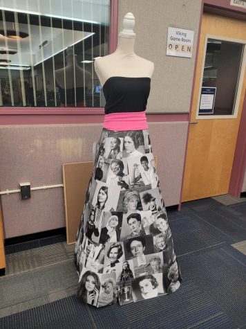 A dress display in the library showcasing various well known women. 