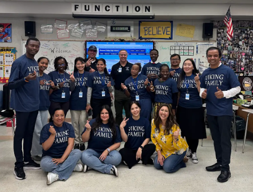 The international teachers pose with Mrs. Besnard for a photo.