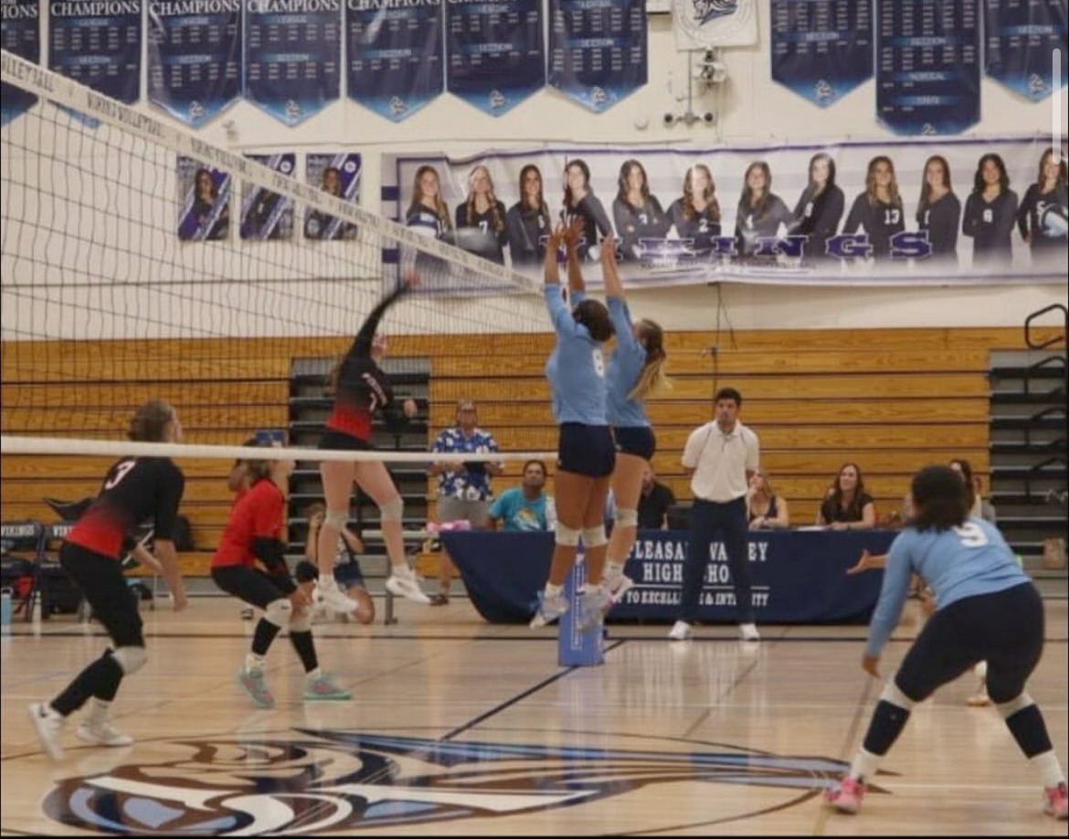 Taryn Ewers and Lydia Beals block the ball!